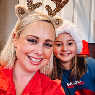 Mother and child dressing up for Christmas